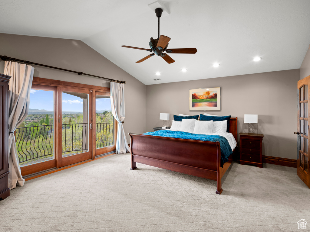 Bedroom with light carpet, vaulted ceiling, recessed lighting, and access to exterior