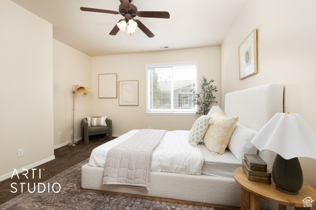 Carpeted bedroom featuring a ceiling fan, baseboards, and visible vents