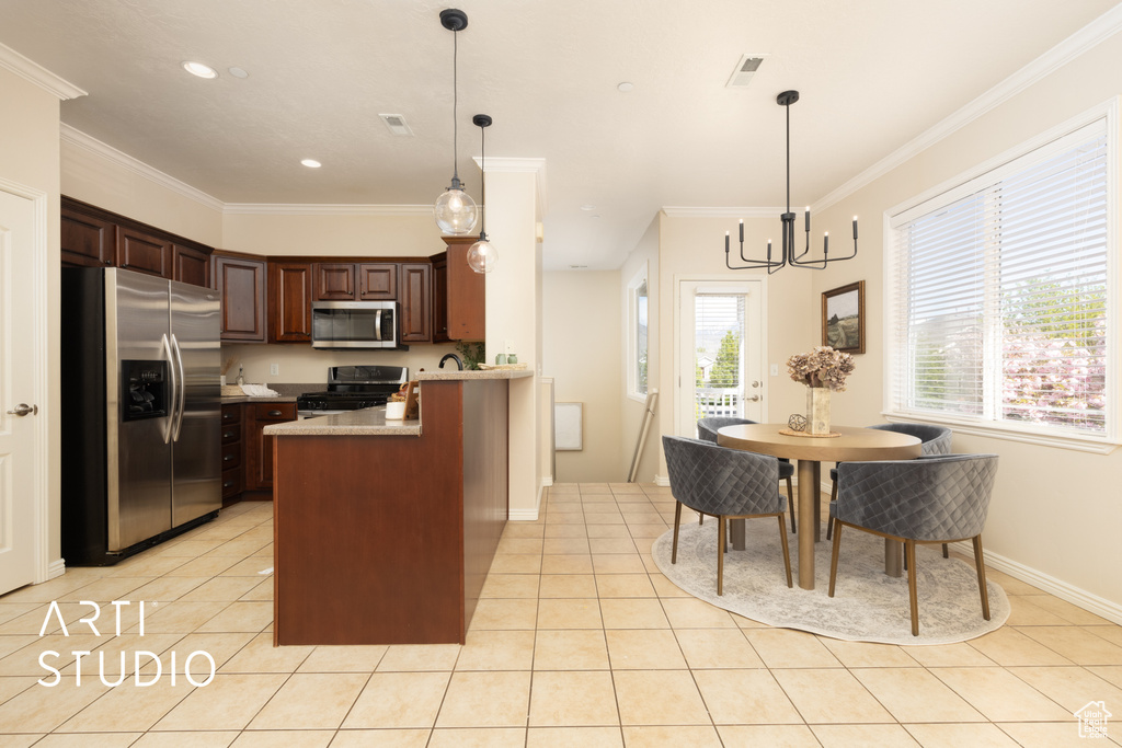 Kitchen featuring light countertops, stainless steel appliances, a peninsula, light tile patterned floors, and visible vents