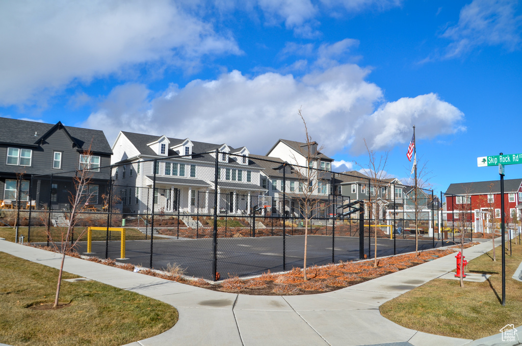 View of community featuring fence and a residential view