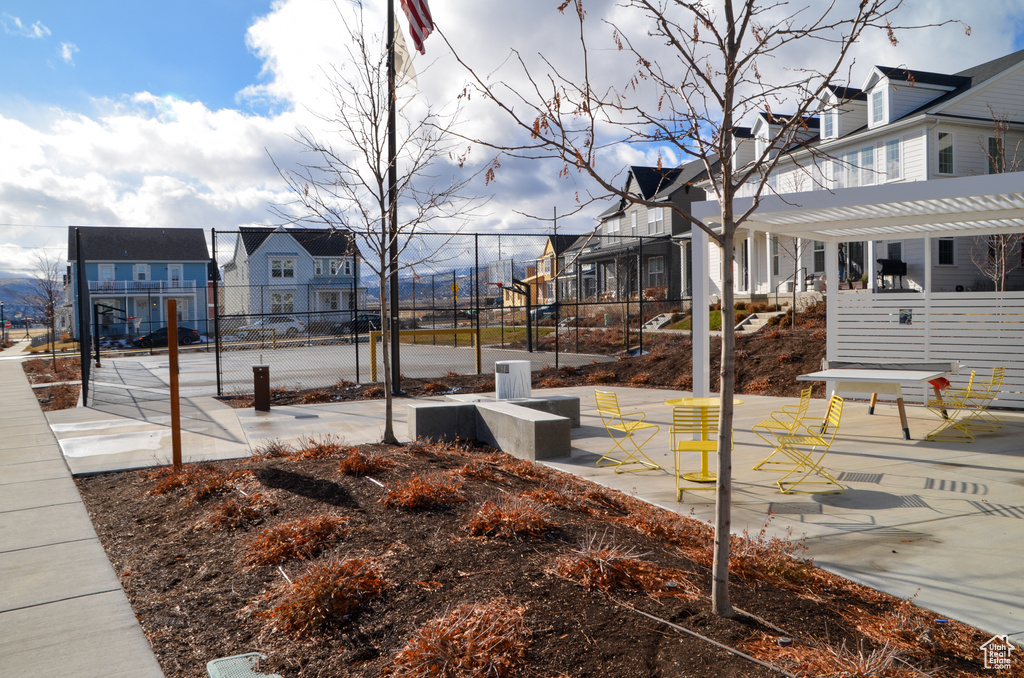 Surrounding community with a residential view, fence, and a pergola
