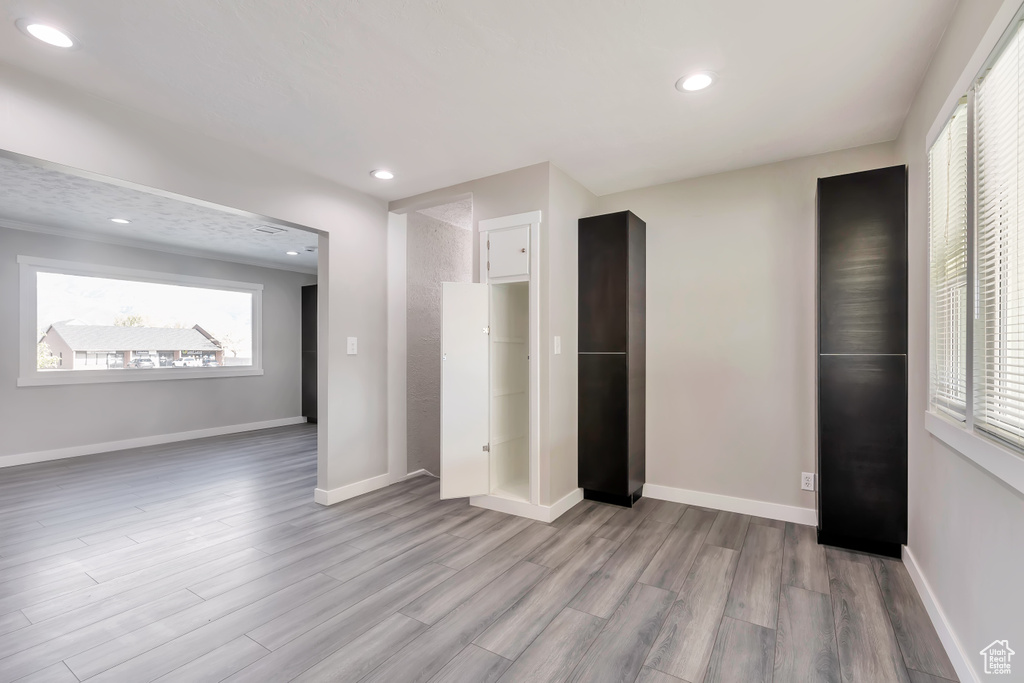 Interior space featuring recessed lighting, baseboards, and wood finished floors