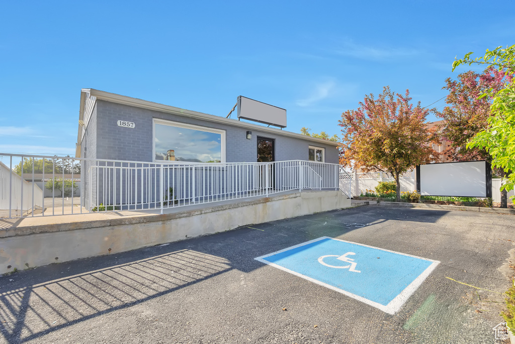 View of parking / parking lot with fence