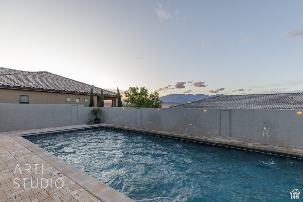 View of pool featuring a fenced in pool and a fenced backyard