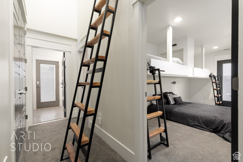 Interior space with baseboards, carpet, and recessed lighting