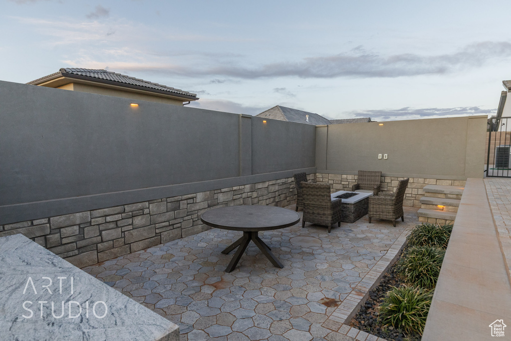 View of patio / terrace featuring a fenced backyard, outdoor lounge area, and central AC unit