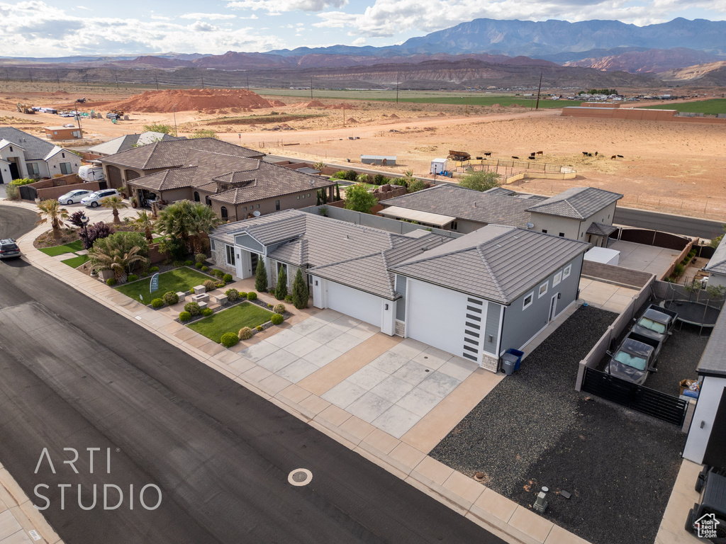 Birds eye view of property featuring a mountain view and a residential view