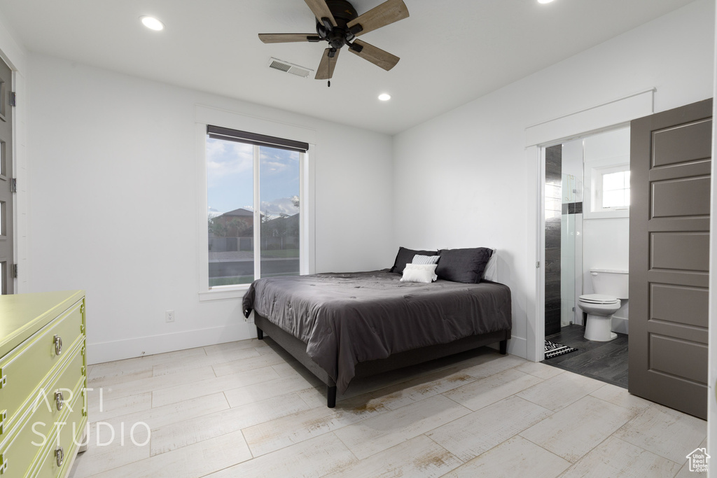 Bedroom with a ceiling fan, visible vents, baseboards, ensuite bathroom, and recessed lighting