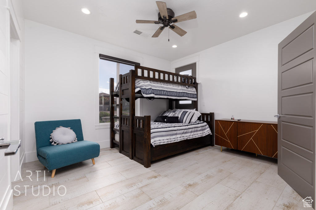 Bedroom featuring recessed lighting, a ceiling fan, and wood finished floors