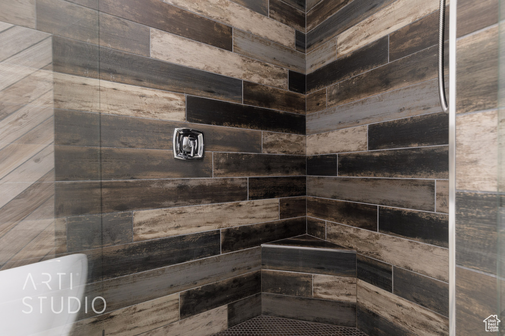 Full bathroom with tiled shower