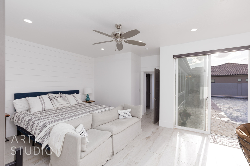 Bedroom featuring recessed lighting, ceiling fan, and access to outside