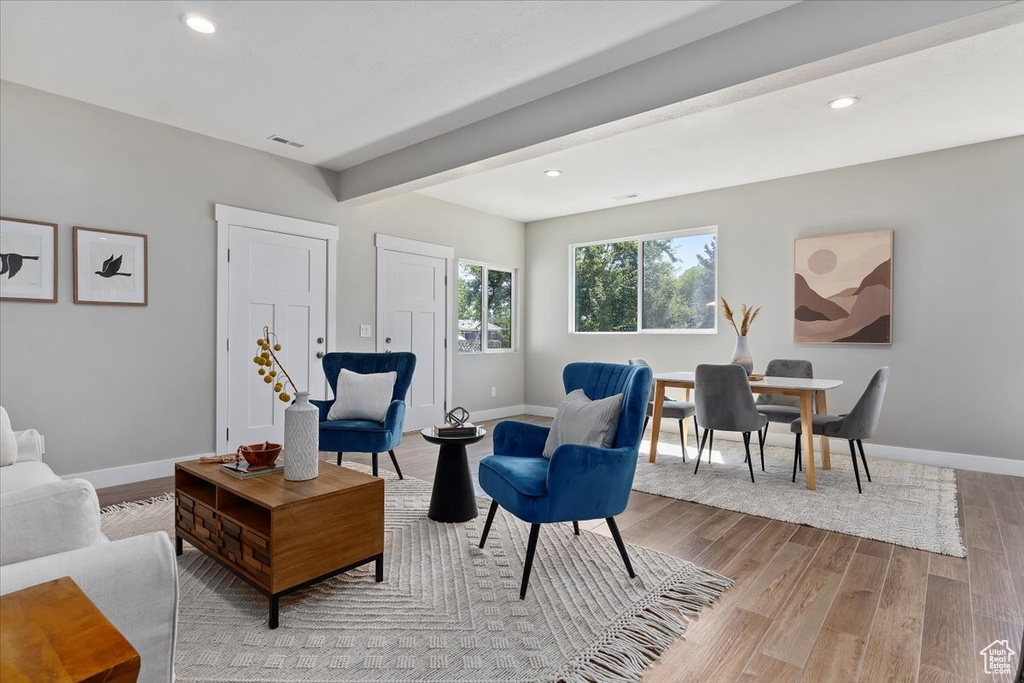 Living area featuring baseboards, recessed lighting, visible vents, and light wood-type flooring