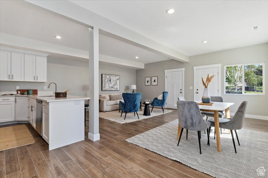 Dining room featuring baseboards, recessed lighting, and dark wood-style floors