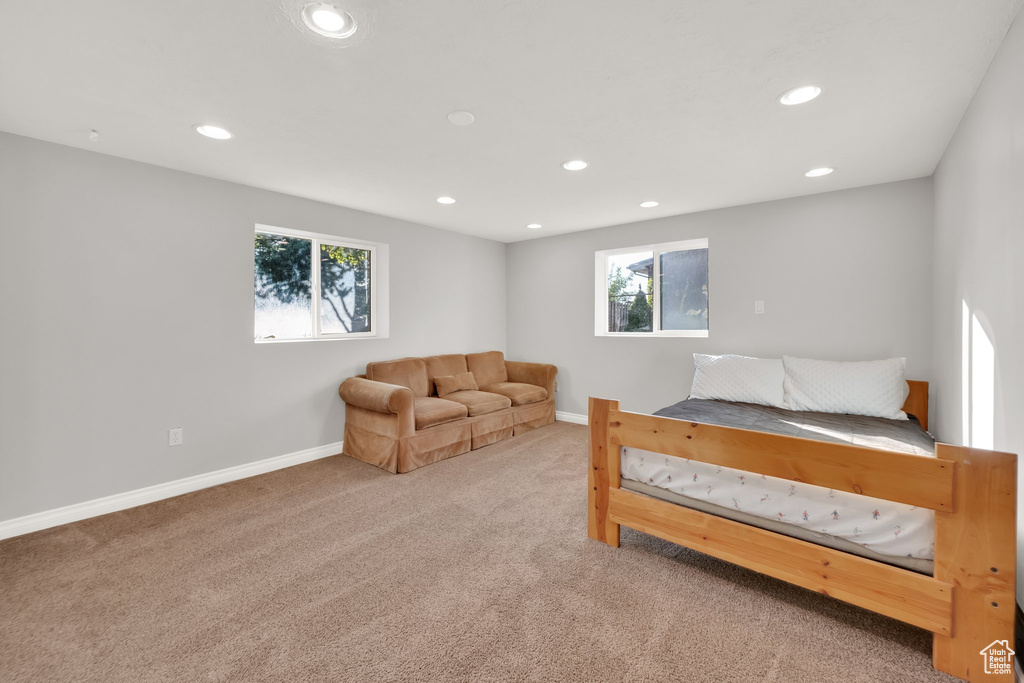 Bedroom with recessed lighting, baseboards, multiple windows, and carpet