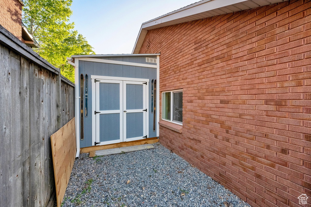 View of shed with fence