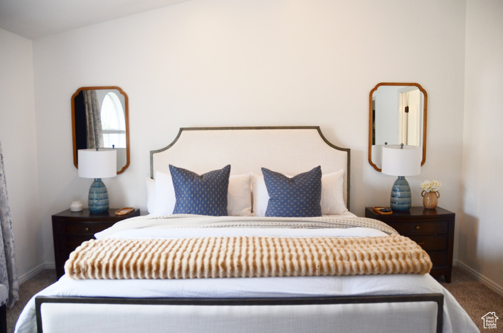 Carpeted bedroom featuring baseboards
