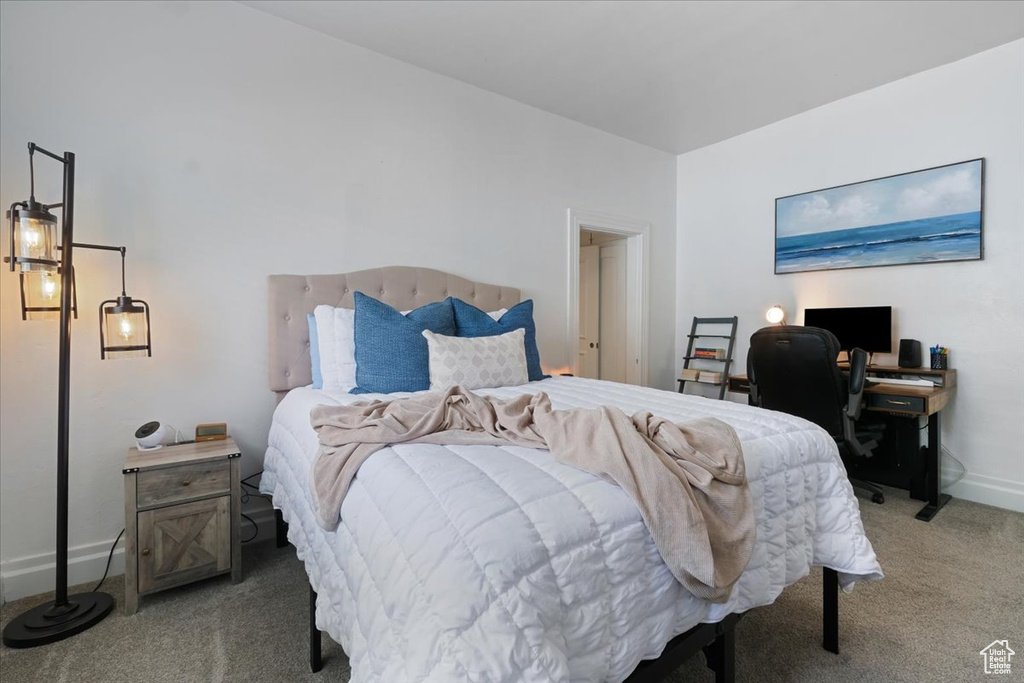 Carpeted bedroom with baseboards