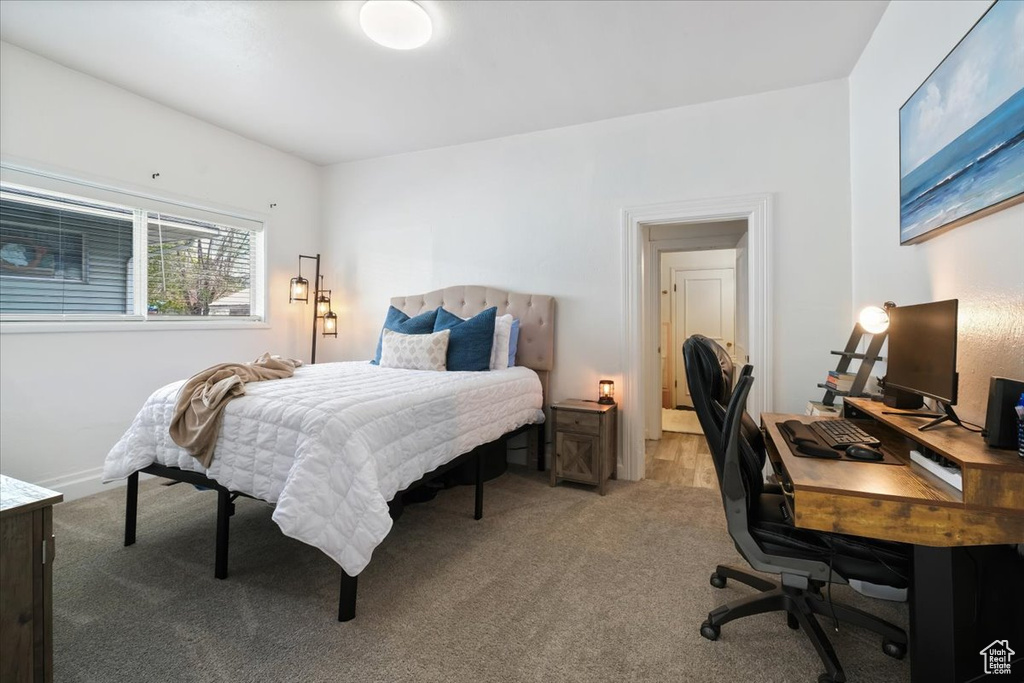 Bedroom with light carpet