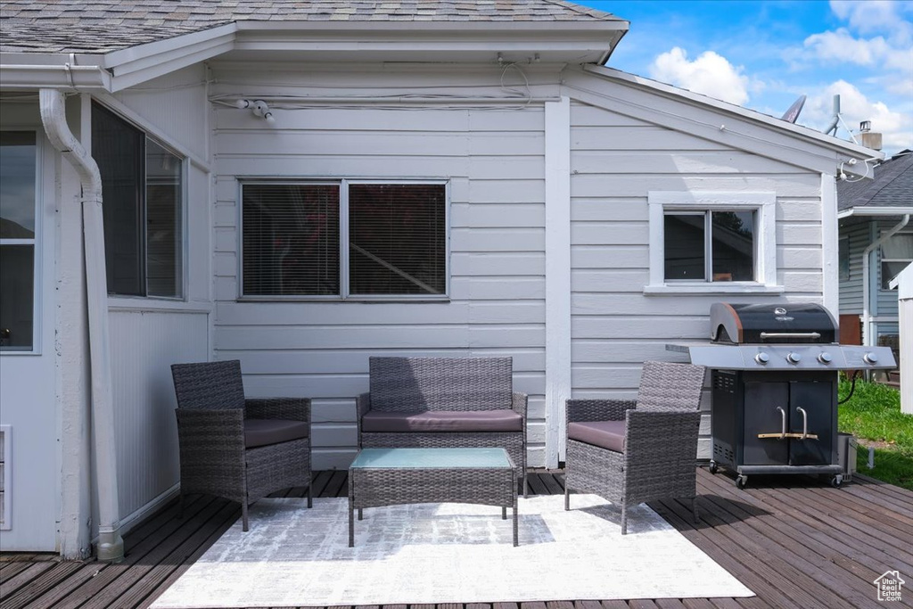 Deck featuring outdoor lounge area and grilling area