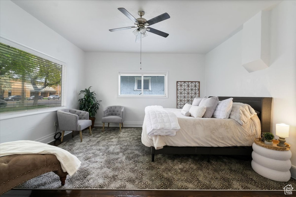 Bedroom with a ceiling fan and baseboards