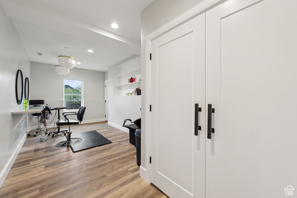 Office space featuring recessed lighting, baseboards, visible vents, and light wood-style flooring