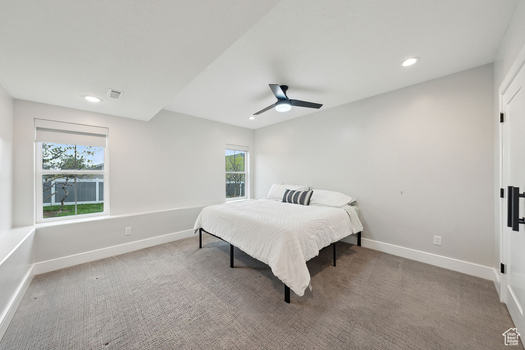Bedroom with ceiling fan, visible vents, baseboards, carpet flooring, and recessed lighting