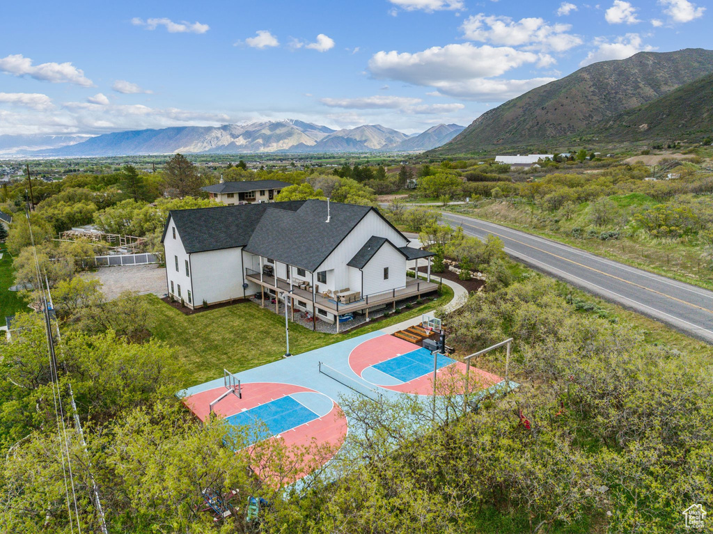 Birds eye view of property with a mountain view