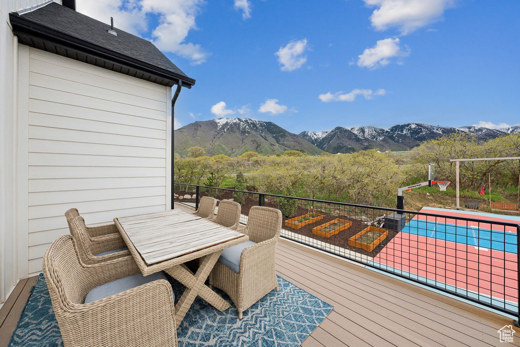 Wooden terrace featuring a mountain view