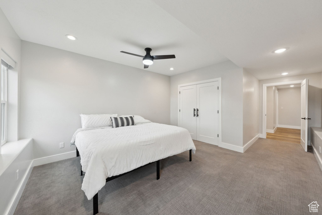 Carpeted bedroom featuring recessed lighting and baseboards