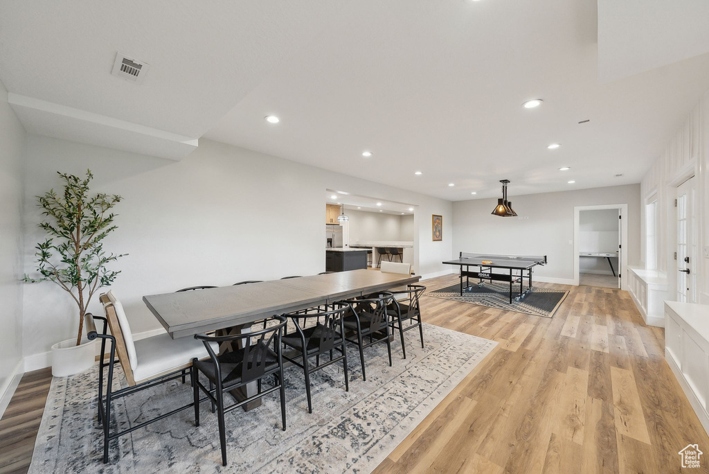 Dining room featuring baseboards, recessed lighting, light wood-style flooring, and visible vents