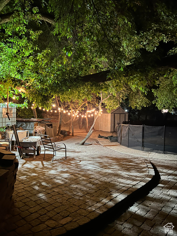 View of patio / terrace featuring a trampoline and fence