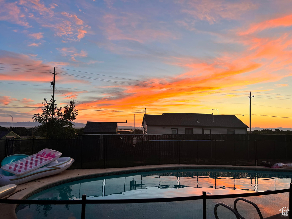 View of pool featuring fence and a fenced in pool
