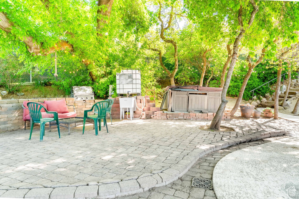 View of patio / terrace featuring a hot tub