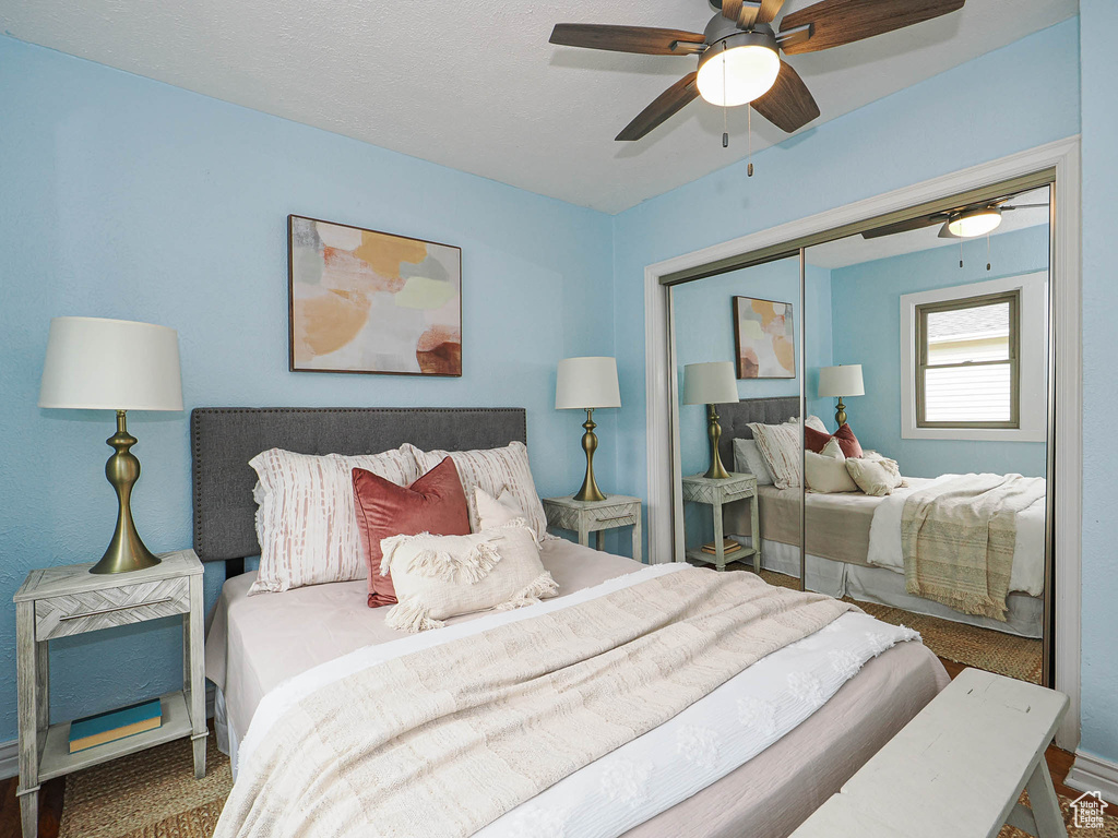 Bedroom featuring a ceiling fan and a closet