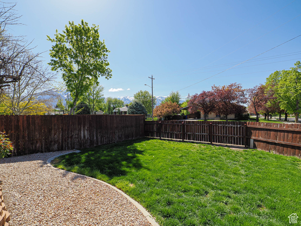 View of yard featuring a fenced backyard