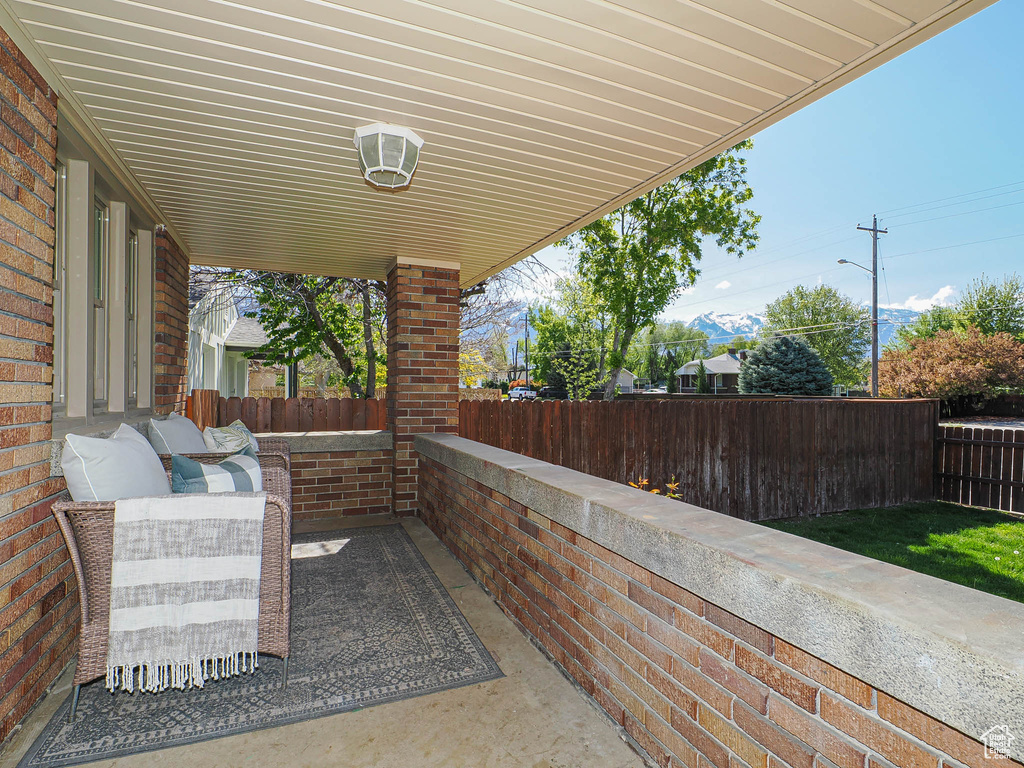 View of patio with fence