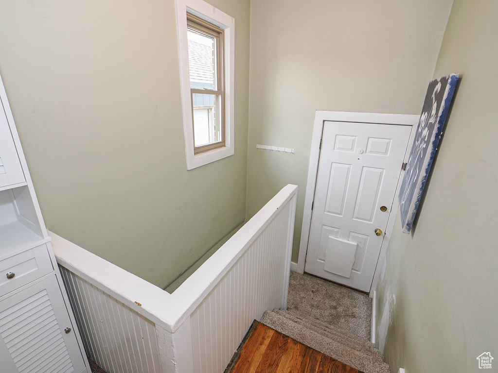 Stairway with wood finished floors