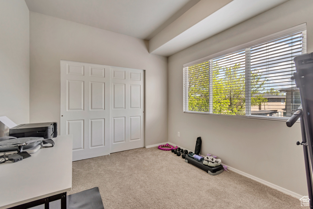 Interior space with baseboards and carpet