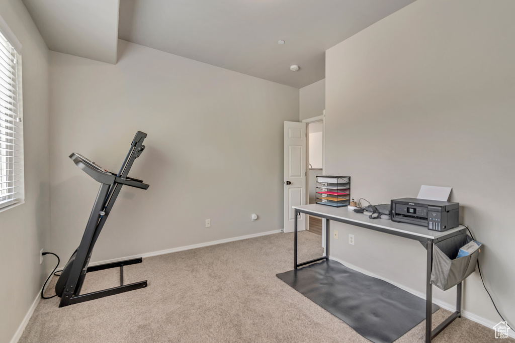 Carpeted office featuring baseboards