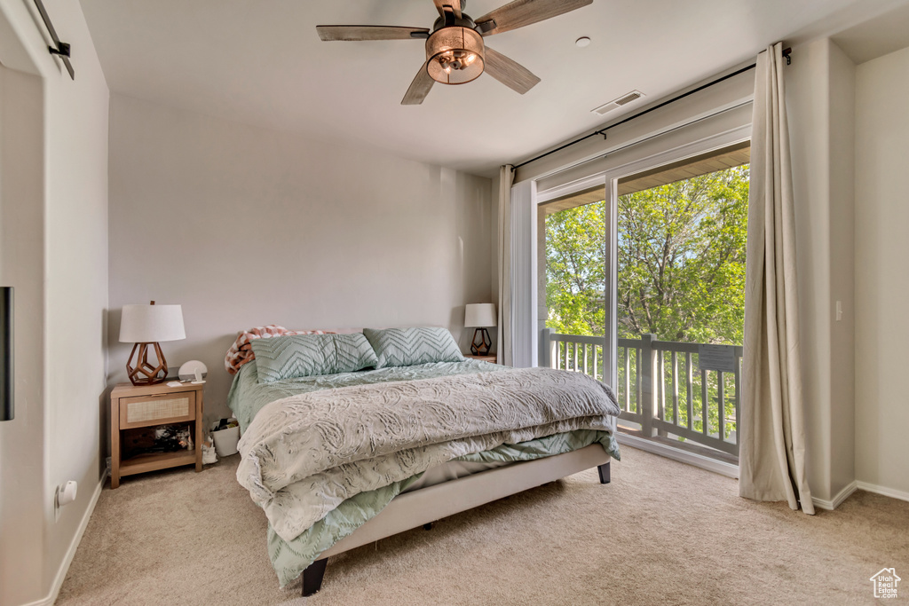Bedroom featuring visible vents, a ceiling fan, baseboards, access to outside, and carpet flooring