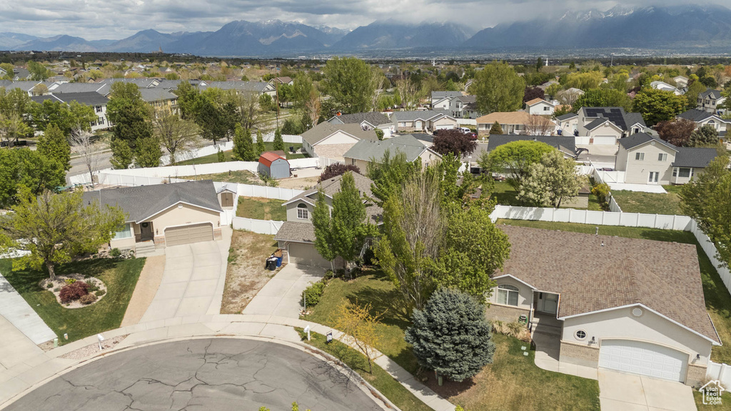 Birds eye view of property with a residential view and a mountain view