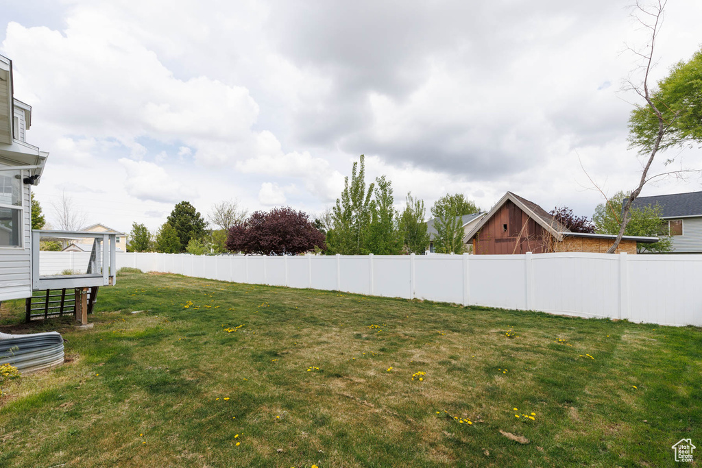 View of yard featuring fence