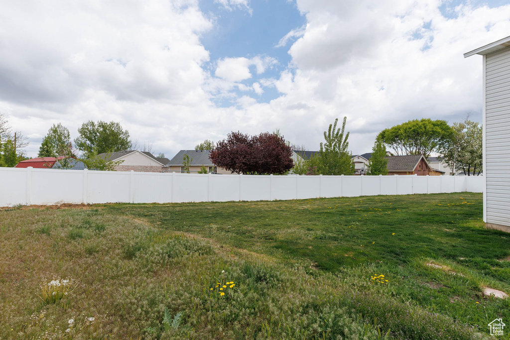 View of yard with fence