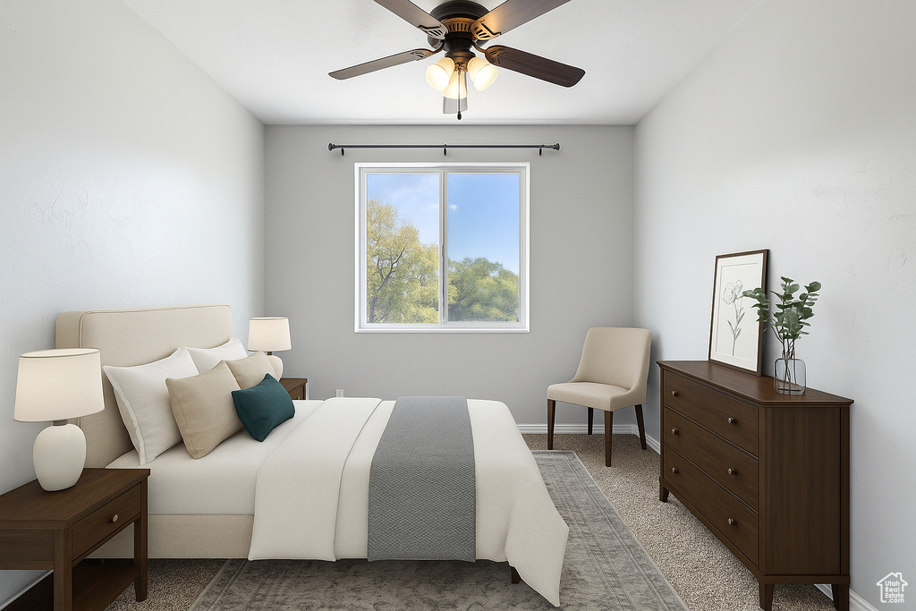 Bedroom featuring a ceiling fan, baseboards, and carpet