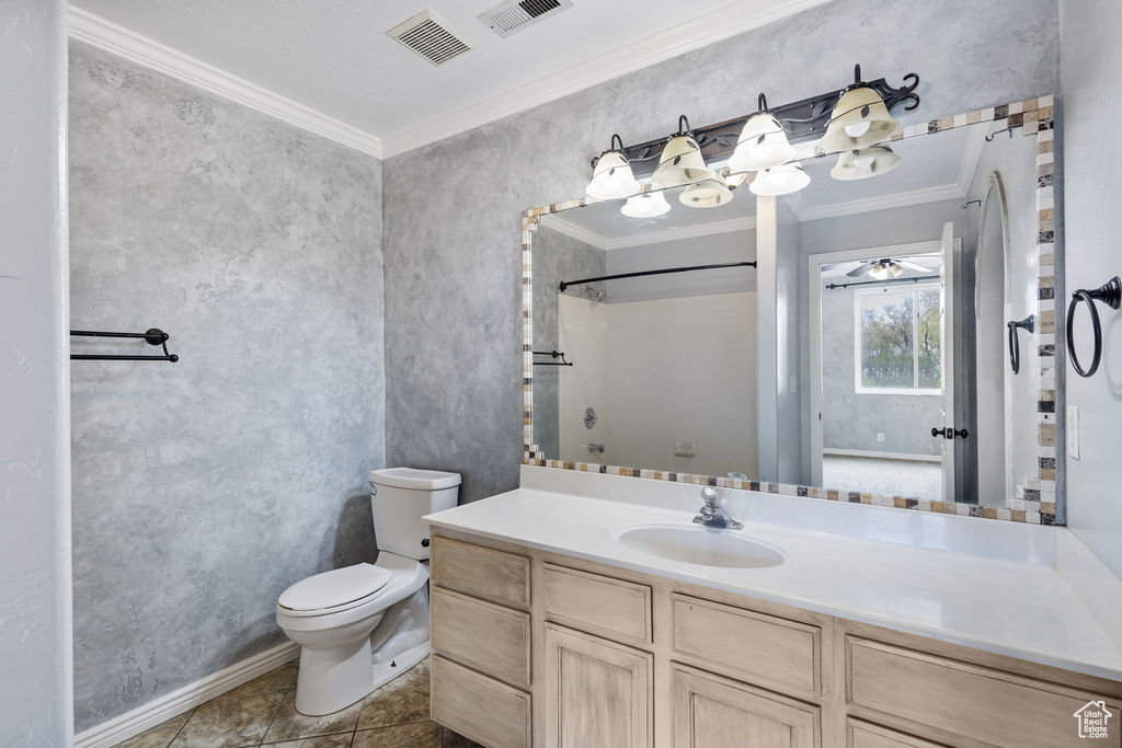 Full bathroom with toilet, visible vents, ornamental molding, and vanity