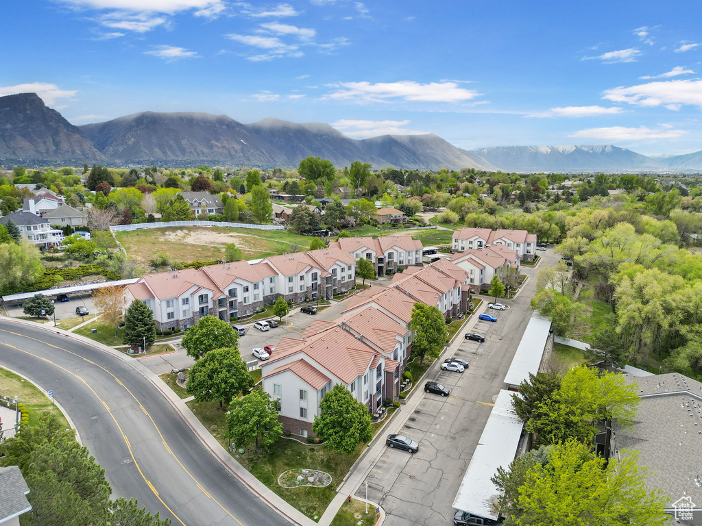 Birds eye view of property with a residential view and a mountain view