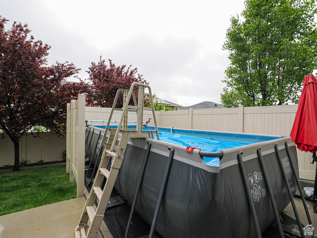 View of swimming pool featuring a fenced in pool and a fenced backyard