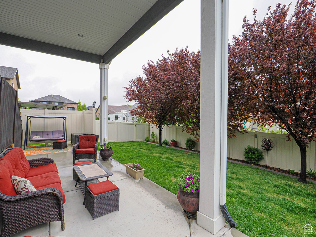View of patio / terrace featuring an outdoor living space and a fenced backyard