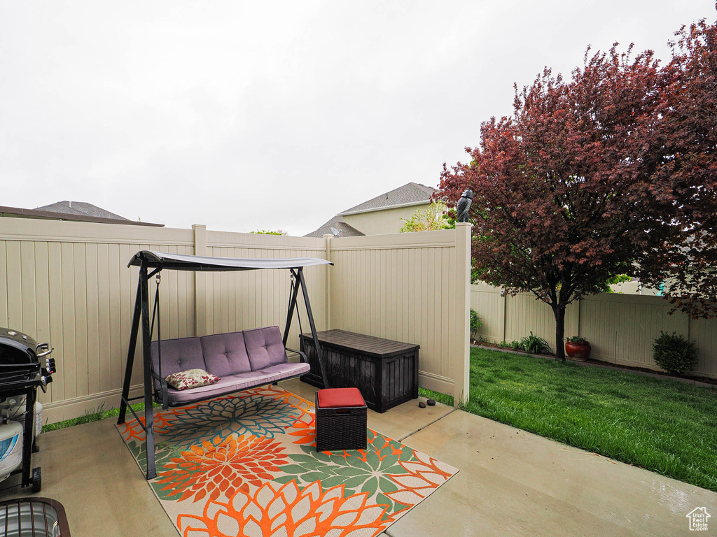 View of patio featuring a fenced backyard and outdoor lounge area