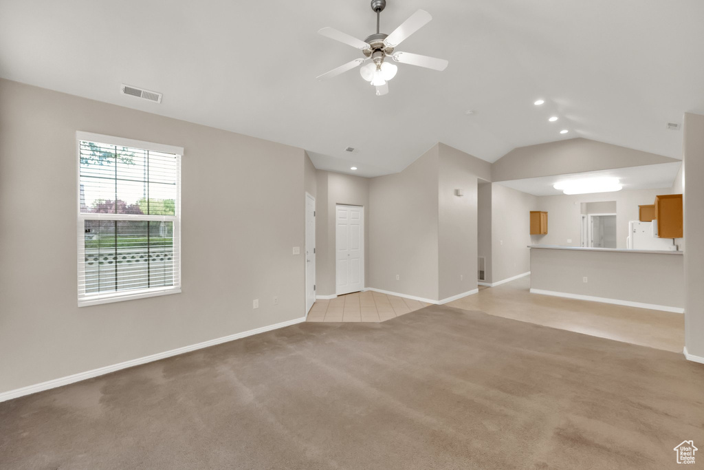 Unfurnished living room featuring ceiling fan, light colored carpet, recessed lighting, baseboards, and visible vents